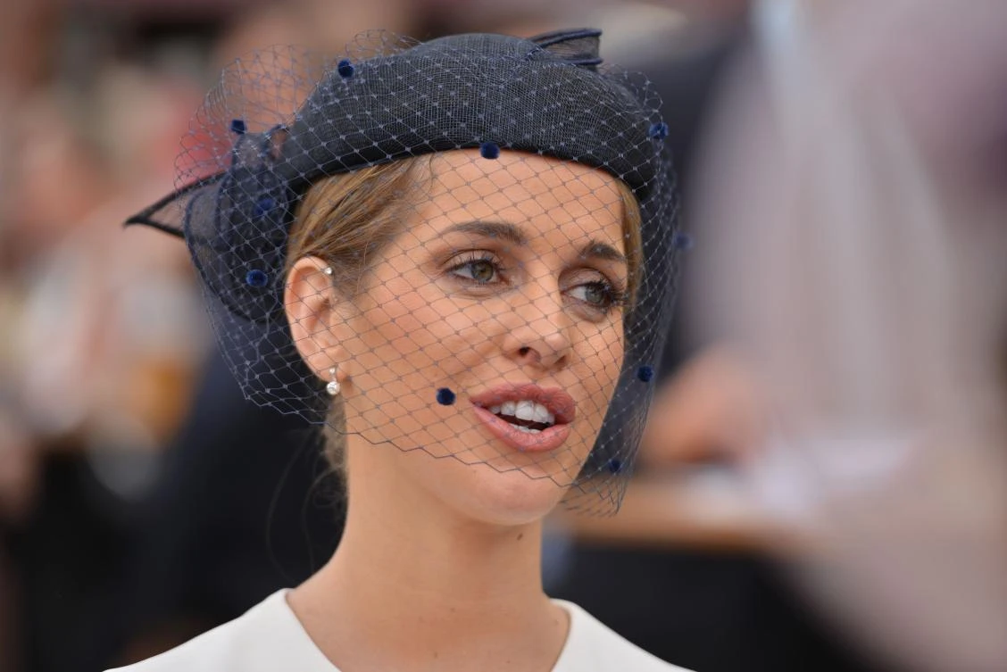 A guest wearing a hat arrives at the Meydan Racecourse to attend the Dubai World Cup day horse racing event , Dubai. (AFP)