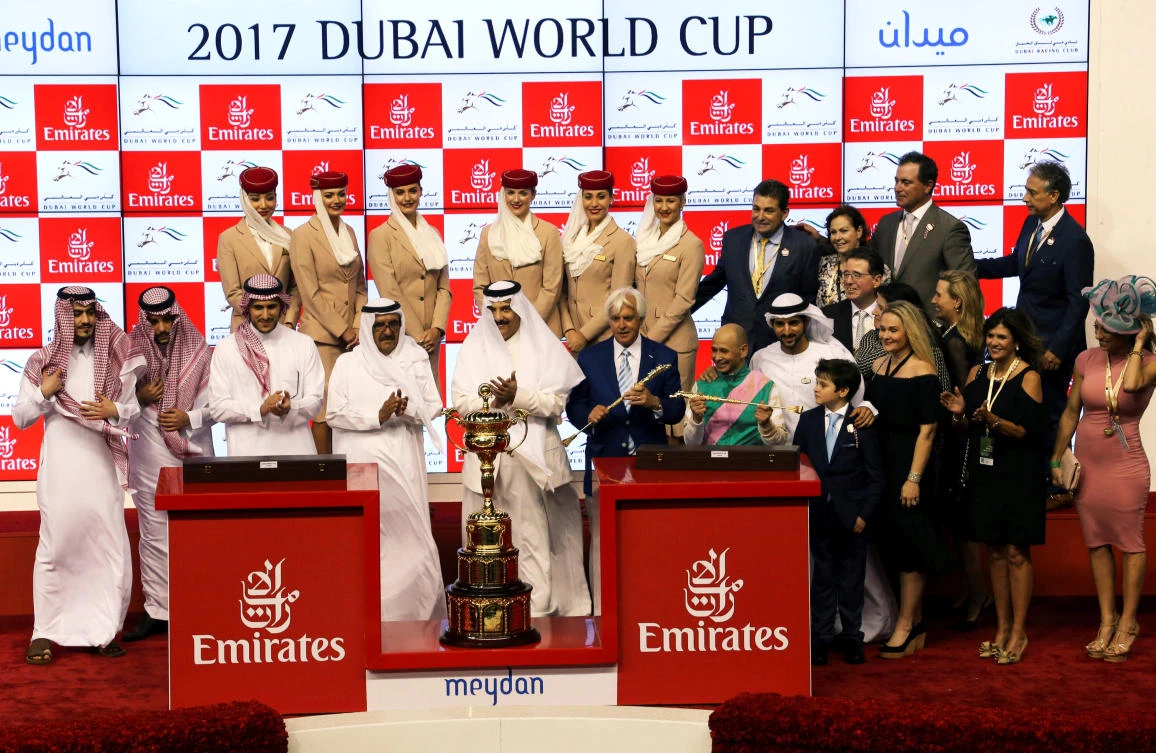 Meydan Racecourse, Dubai - Mike Smith who rodes Arrogate celebrates winning the ninth and final race. (REUTERS)