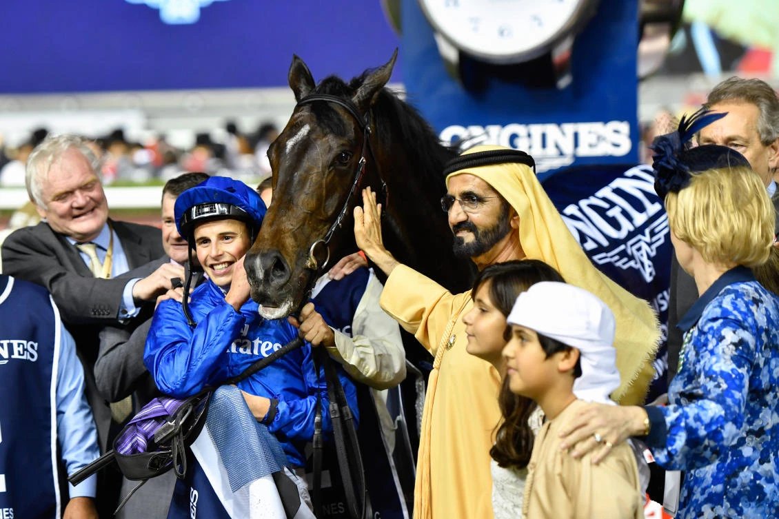 celebrates with Jockey William Buick after they won the Longines Dubai Sheema Classic at the Dubai World Cup in the Meydan Racecourse (AFP)