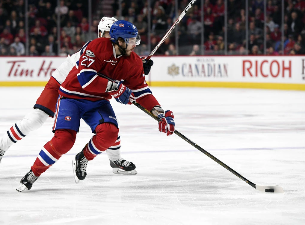 Montreal Canadiens forward Alex Galchenyuk (27) plays the puck as Columbus Blue Jackets forward Alexander Wennberg (10) defends during the third period at the Bell Centre on Tuesday night. (USA TODAY Sports)