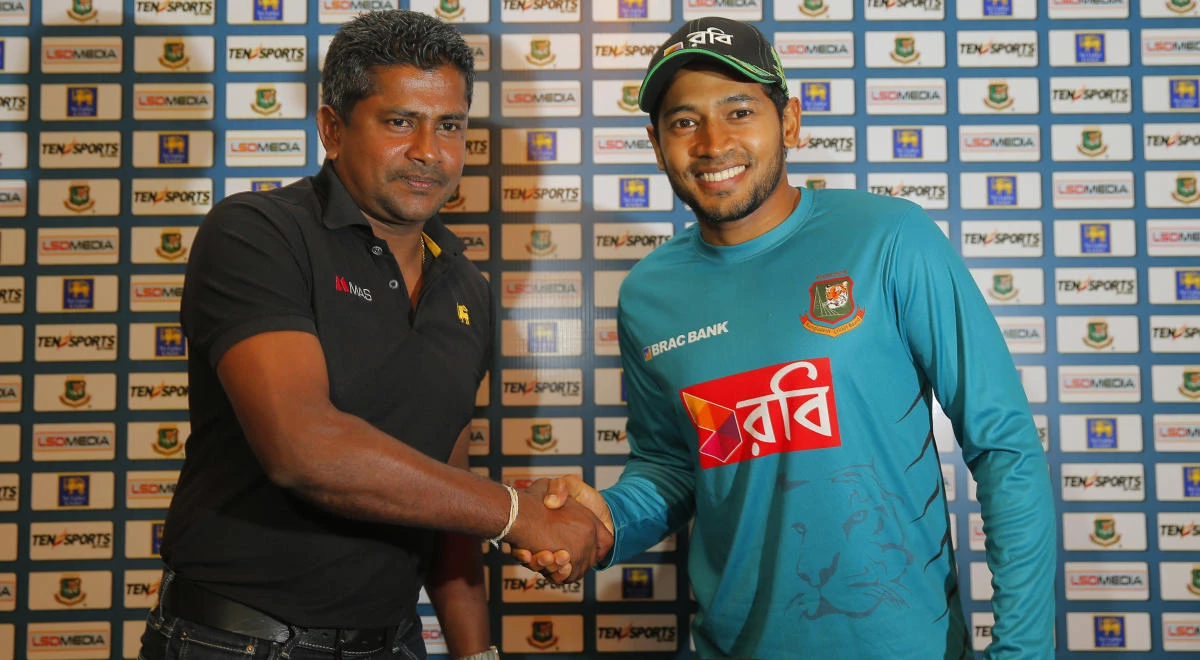 Bangladesh captain Mushfiqur Rahim, right, shakes hands with his Sri Lankan counterpart Rangana Herath at a media briefing in Colombo. (AP)