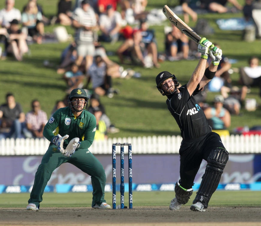 New Zealand batsman Martin Guptill, right, watches as he hits the ball for six runs during their one day cricket international match against South Africa at Seddon Park, Hamilton, New Zealand, Wednesday. (AP)
