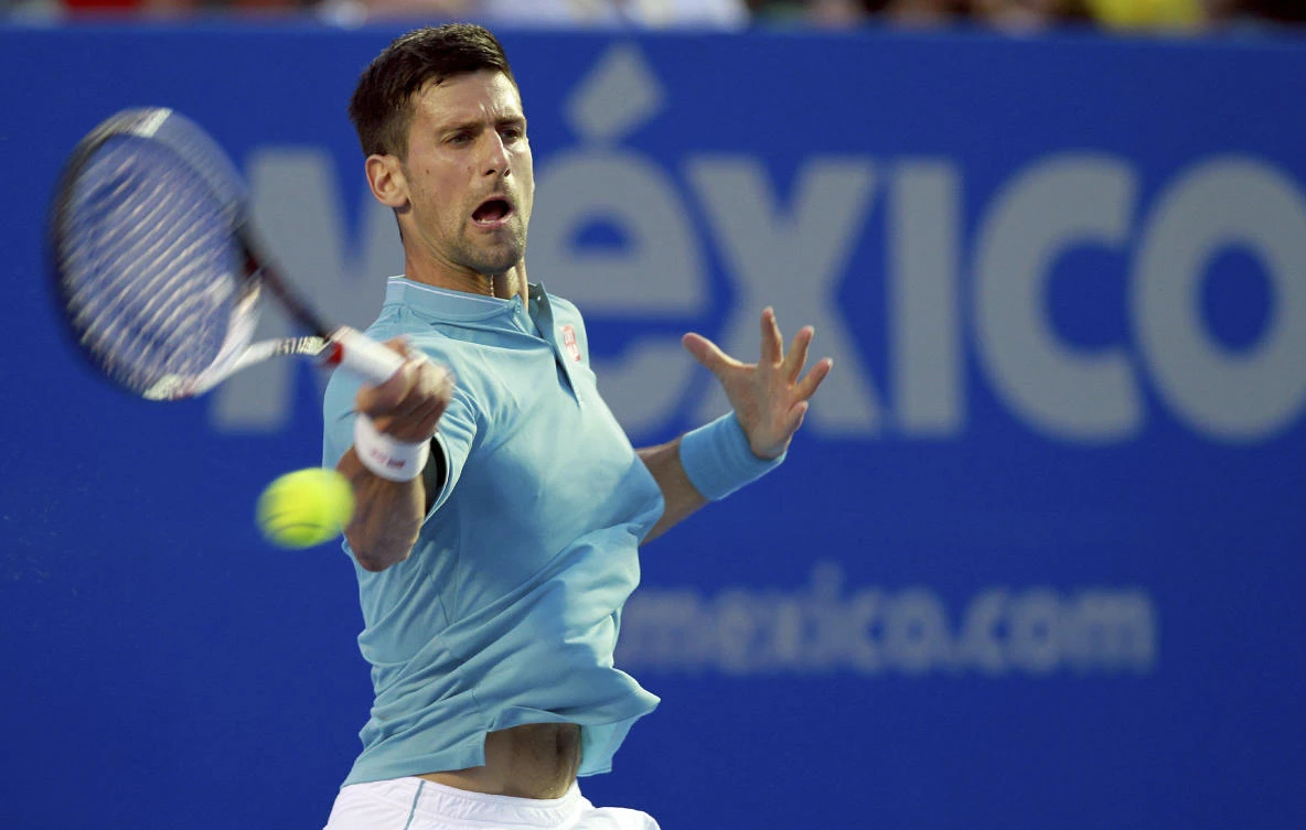Serbia's Novak Djokovic returns the ball to Slovakia's Martin Klizan during the Mexican Tennis Open in Acapulco, Mexico, Tuesday. (AP)