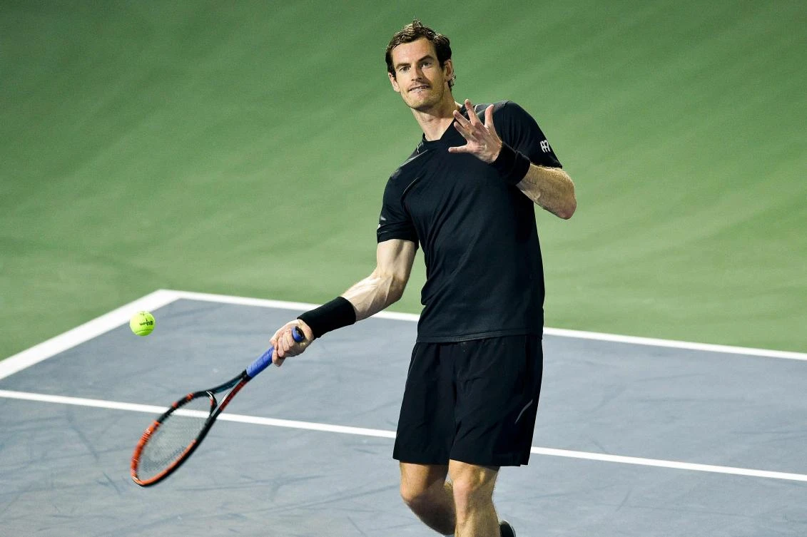 World No. 1 Britain's Andy Murray throws balls to the crowd, after winning his match against Guillermo Garcia-Lopez of Spain during the ATP Dubai Duty Free Tennis Championships in Dubai, on Wednesday. (AFP)