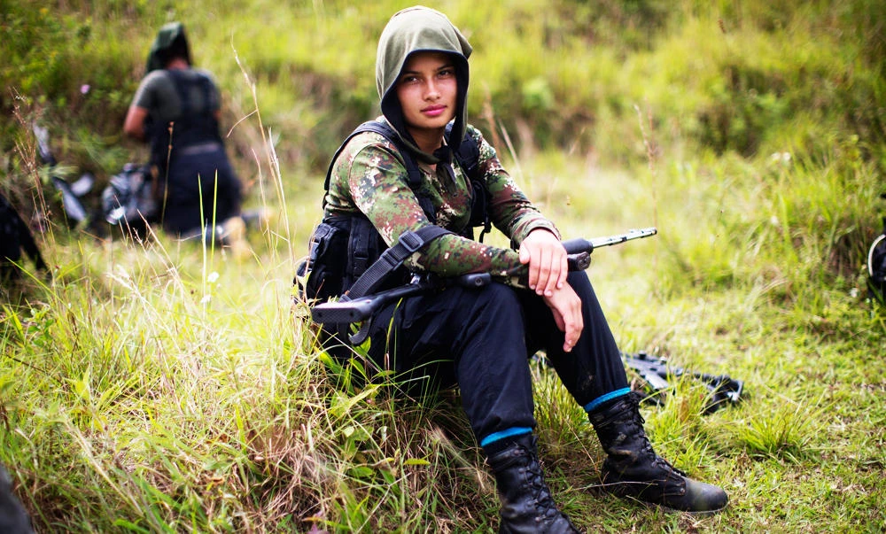 In this Jan. 6, 2016 file photo, Juliana, a 20-year-old rebel fighter for the 36th Front of the Revolutionary Armed Forces of Colombia, or FARC, rests from a trek in the northwest Andes of Colombia, in Antioquia state. (AP)