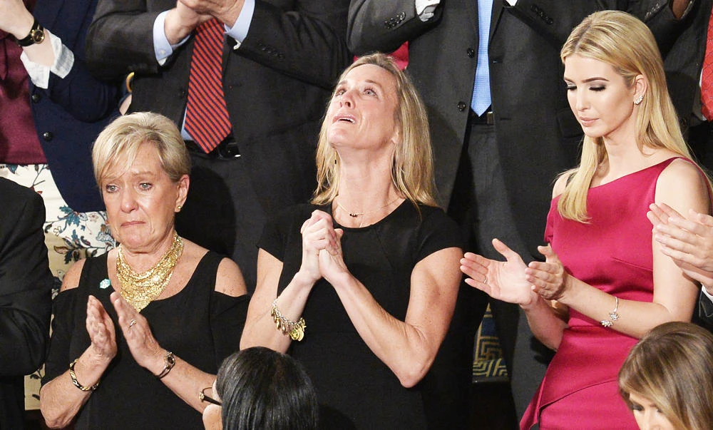 Carryn Owens, wife of Navy SEAL William "Ryan" Owens, is recognized as US President Donald Trump addresses a joint session of the US Congress on Tuesday. (AFP)