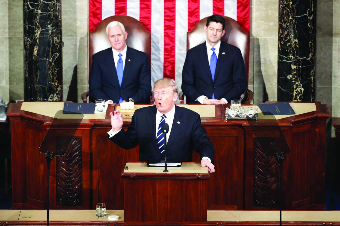 US President Donald Trump addresses a joint session of the US Congress as Vice President Mike Pence, left, and House Speaker Rep. Paul Ryan, right, (R-WI) listen, on Tuesday in the House chamber of the US Capitol in Washington, DC. (AFP)