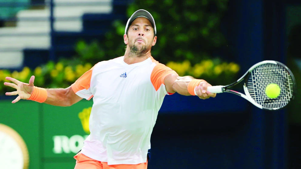 Fernando Verdasco of Spain returns the ball to Gael Monfils of France during a quarterfinal match of the Dubai Duty Free Tennis Championships in Dubai Thursday. (AP)