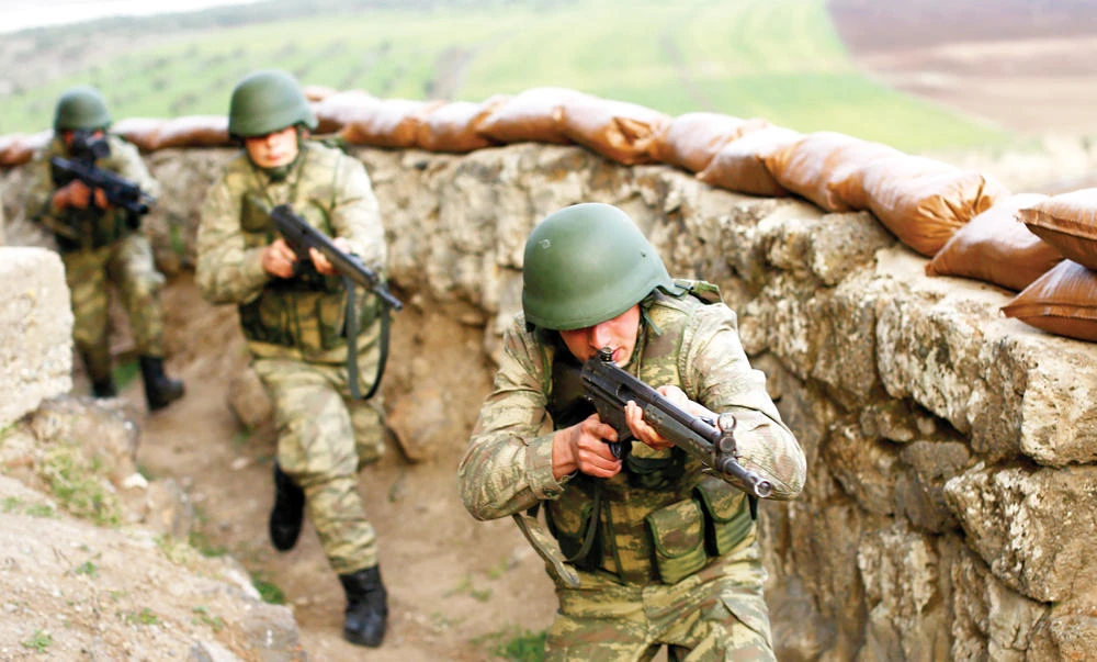 Turkish soldiers participate in an exercise on the Turkish-Syria border near the southeastern city of Kilis, Turkey. (Reuters)