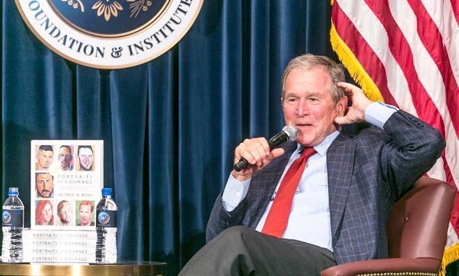 Former President George W. Bush speaks during a press preview of an exhibition of his paintings of US military veterans in Dallas. (AP)
