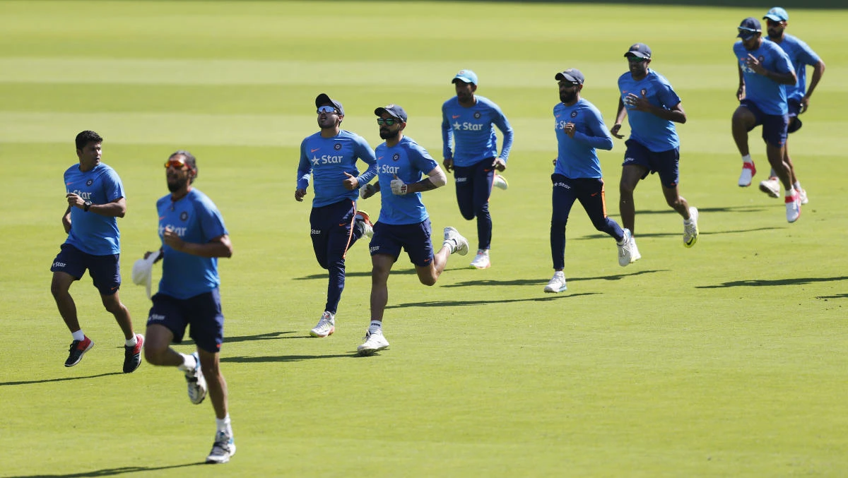 Indian players warm up during a training session ahead of their second cricket Test match against Australia in Bangalore on Friday. (AP)
