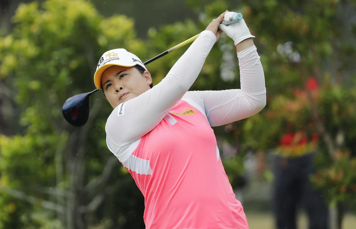 Inbee Park of South Korea tees off on the 3rd hole during the HSBC Women's Champions golf tournament held at Sentosa Golf Club's Tanjong course in Singapore on Friday. (AP)