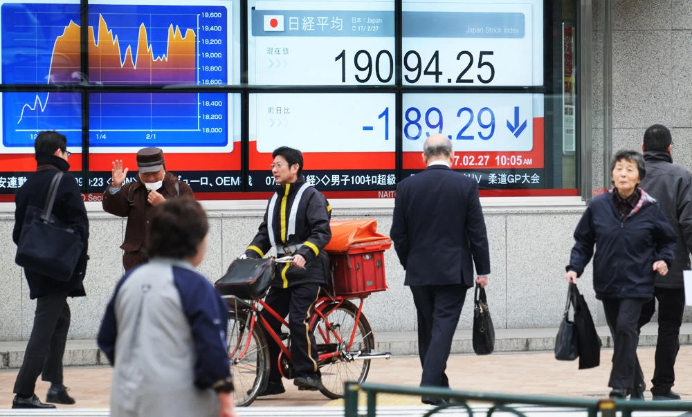 An electric quotation board flashing the Nikkei key index of the Tokyo Stock Exchange is displayed at a securities company in Tokyo, in this February 27, 2017 photo. (AFP)