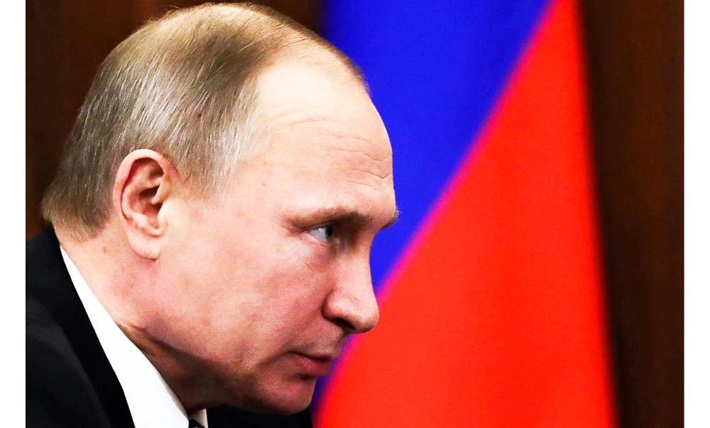 Russian President Vladimir Putin meets with Deputy Prime Minister Alexander Khloponin in the Kremlin in Moscow, Russia, on Friday. (AP)
