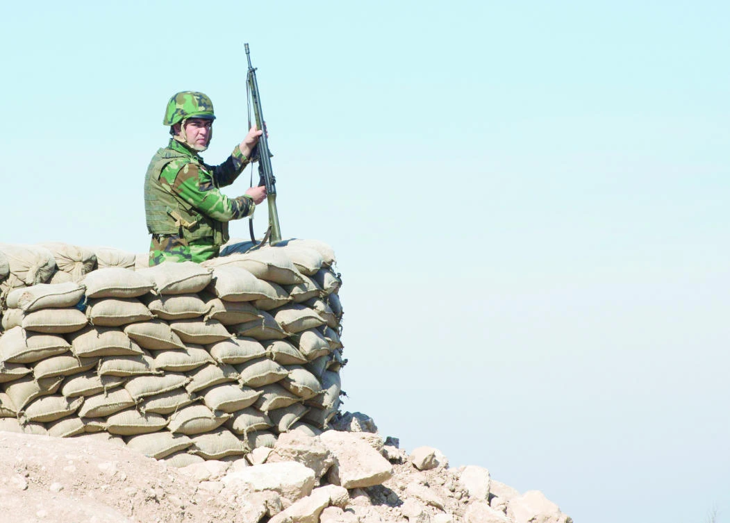 A Peshmerga soldier mans an observation post in northern Iraq. (AP)