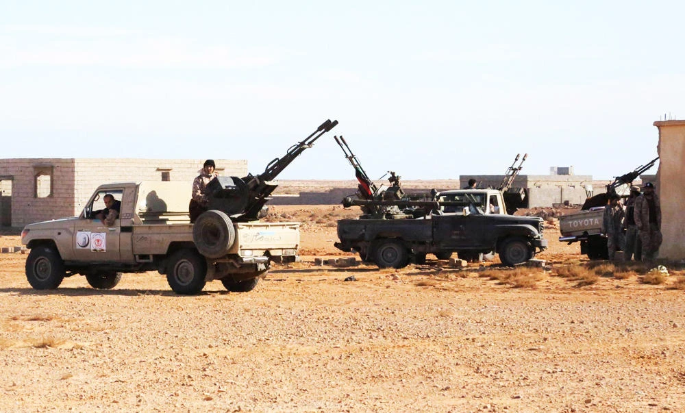 Libyan Army Forces belonging to Libya's rival government, that are part of the Alshorooq (Libya Dawn) operation to free oil ports, are seen on the outskirts of Al Sidra oil port, in this December 14, 2014 file photo. (Reuters)