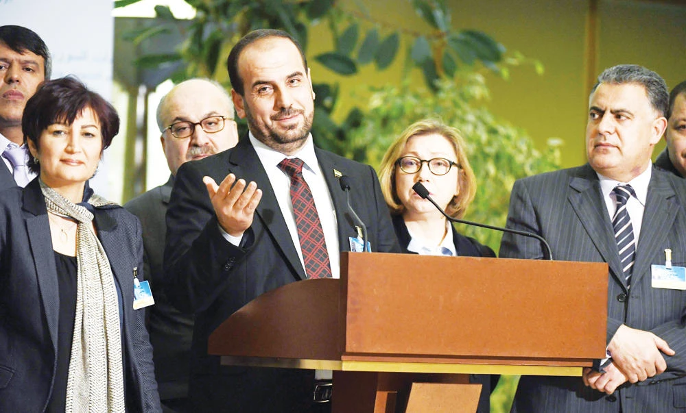 Syria’s main opposition High Negotiations Committee (HNC) leader Nasr Al-Hariri addresses a press conference at the European headquarters of the UN in Geneva on Friday. (AFP)