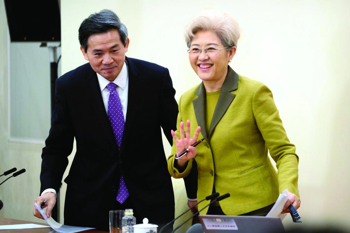 Fu Ying, right, the spokeswoman for China’s National People’s Congress, waves as she leaves a press conference held at
the Great Hall of the People in Beijing on Saturday. (AP)