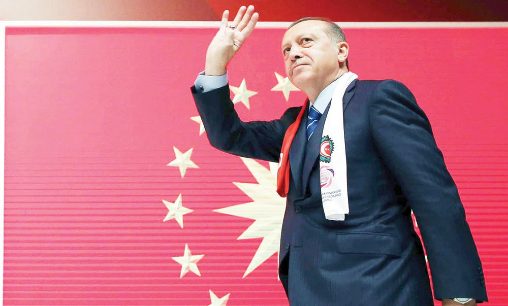 Turkey’s President Recep Tayyip Erdogan salutes before addressing a meeting in Istanbul. (AP)