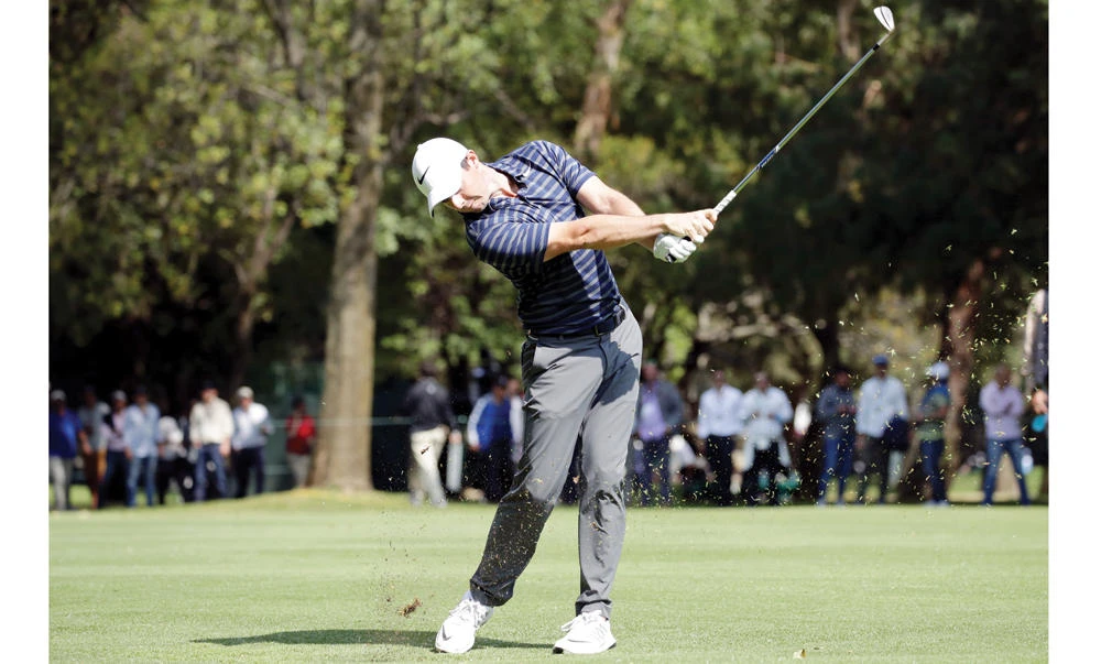 Rory McIlroy of Northern Ireland plays a shot on the fairway on the eighth hole during the second round of the World Golf Championships Mexico Championship at Club De Golf Chapultepec on Friday in Mexico City. (AFP)
