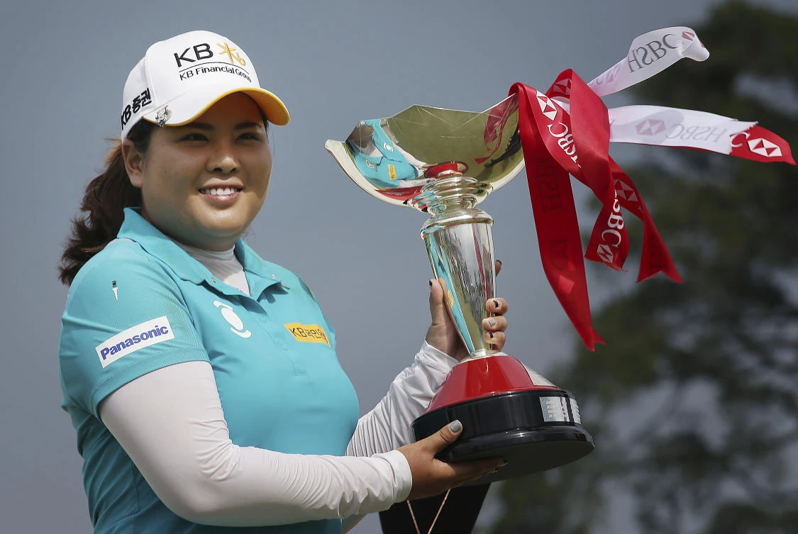 Inbee Park of South Korea poses with her trophy after winning the HSBC Women's Champions golf tournament held at Sentosa Golf Club's Tanjong course on Sunday in Singapore. (AP)