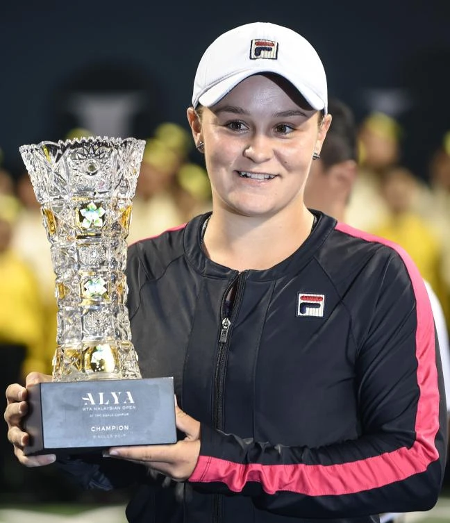 Ashleigh Barty of Australia with her trophy after beating Japan's Nao Hibino in their women's singles finals match of the WTA Malaysian Open tennis tournament in Kuala Lumpur on Sunday. (AFP)