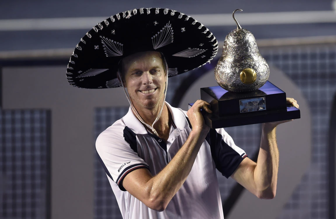 Sam Querrey of the US with the trophy after beating Rafael Nadal of Spain 6-3, 7-6 (7/3) in the ATP men's singles finals of the Mexican Tennis Open in Acapulco, Guerrero State, Mexico, on Saturday. (AFP)