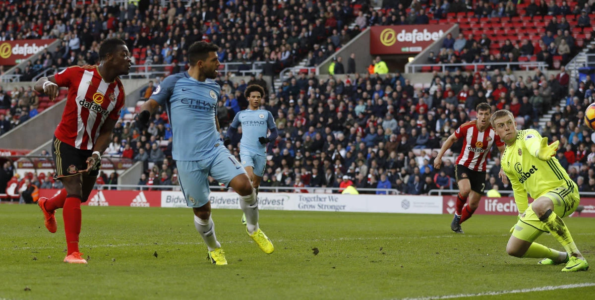 Manchester City's Sergio Aguero scores their first goal during the Premier League match between Sunderland and Manchester City on Sunday. (Reuters)