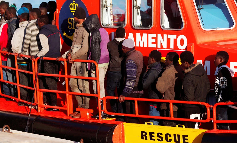 Migrants, who are part of a group intercepted aboard a dinghy off the coast in the Mediterranean sea, stand on a rescue boat upon arriving at a port in Malaga, southern Spain, in this March 2, 2017 photo. (REUTERS)