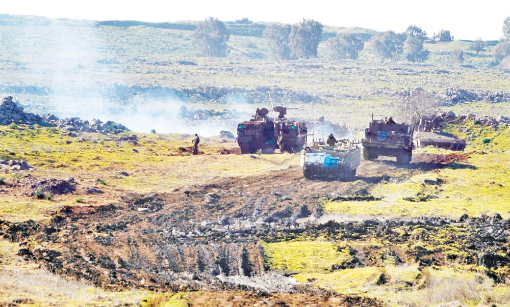 Israeli soldiers take part in military training in the Israeli-annexed Golan Heights, near the Israeli-Syrian border in this file photo. (AFP)