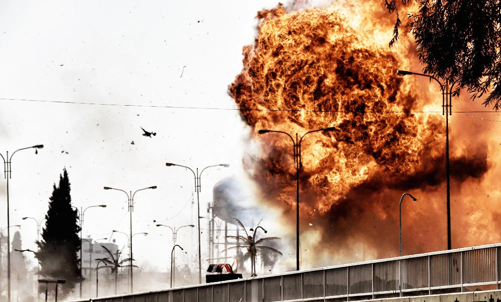 Fire and smoke billow following a car bomb explosion as Iraqi forces clash with Islamic State (IS) group fighters in Mosul on Sunday, during an offensive to retake the western parts of the city from the jihadists. (AFP)
