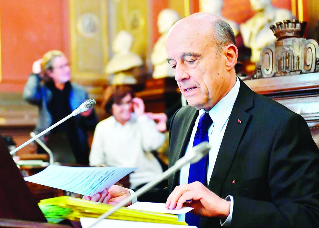Former French Prime Minister and Mayor of Bordeaux Alain Juppe presides over an extraordinary session of the municipal council at the Bordeaux city hall on Monday. (AFP)