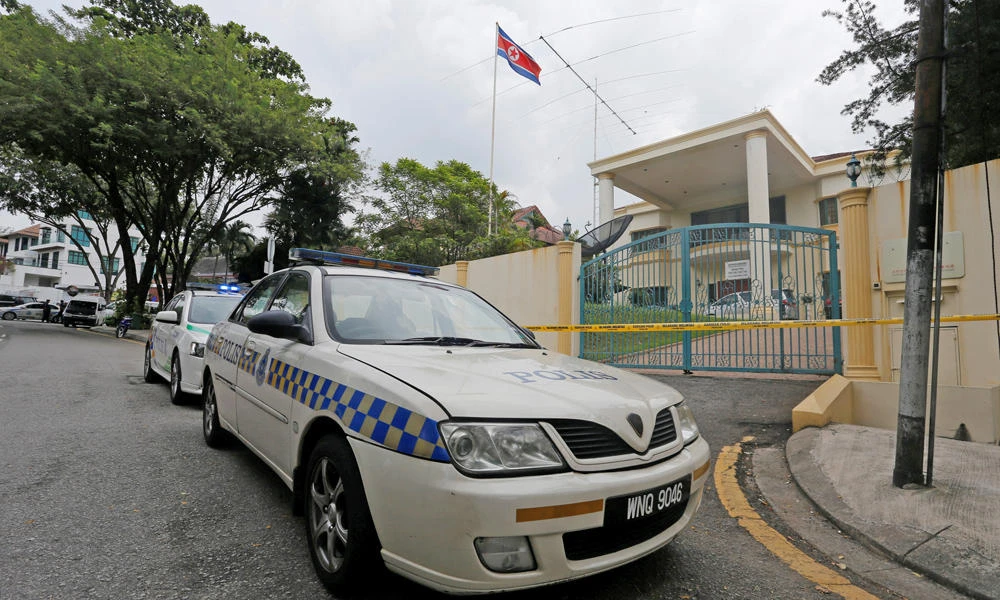 Police cars block the entrance of a sealed off North Korea embassy in Kuala Lumpur, Malaysia, on Tuesday. (REUTERS/Lai Seng Sin)