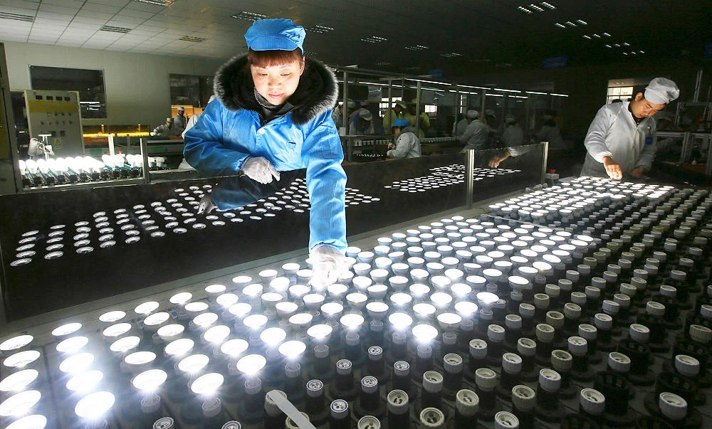 In this Feb. 28, 2017 photo, a worker tests LED lights at a factory in Suining city in southwestern China's Sichuan province. (AP)
