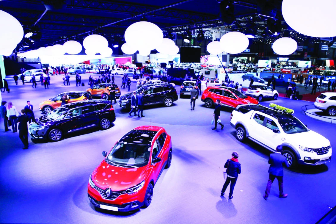 Visitors at the 87th International Motor Show at Palexpo in Geneva, Switzerland on Tuesday. (Reuters)