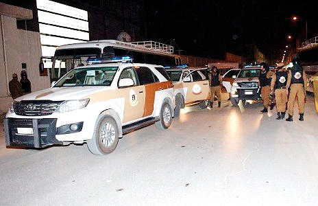 In this file photo, police officers are seen during an anti-terrorist raid in Riyadh.