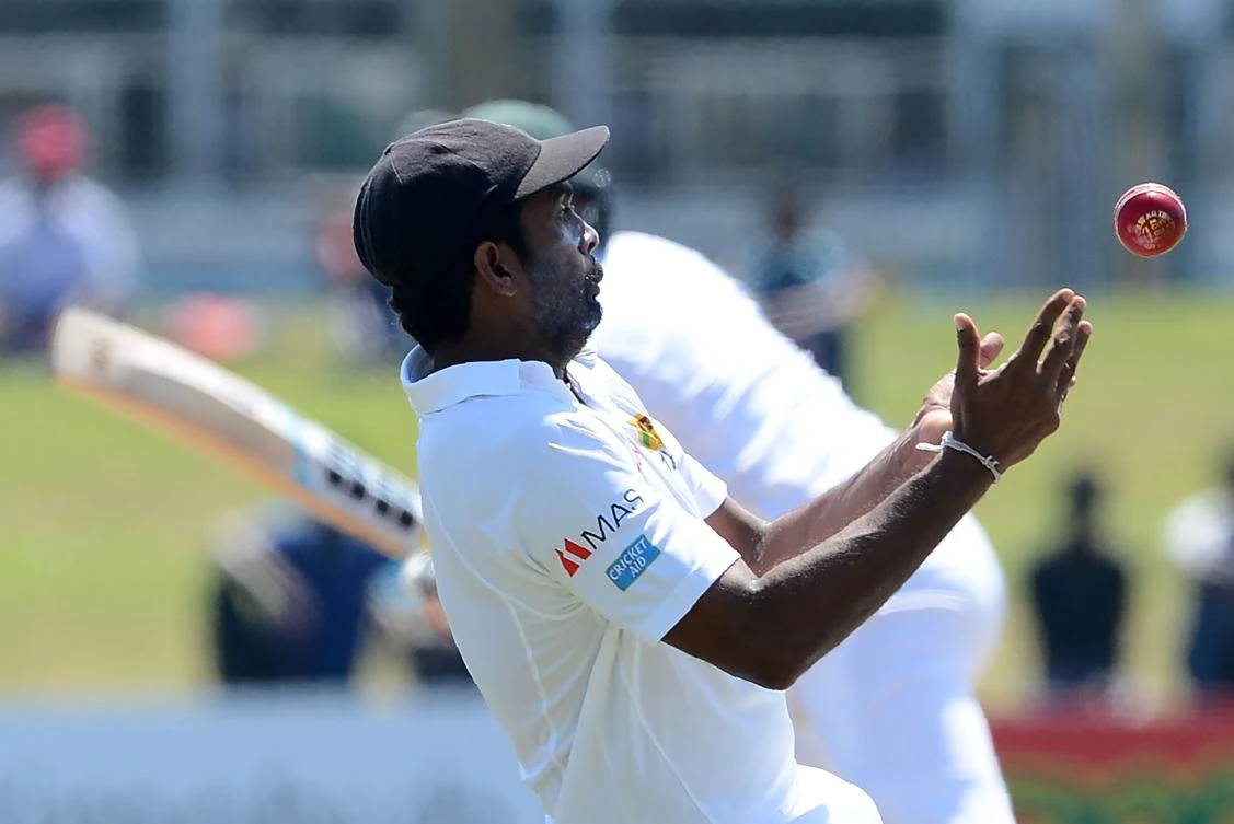 Sri Lankan cricketer Dilruwan Perera drops a catch off Bangladesh cricketer Soumya Sarkar during the second day of the opening Test cricket match between Sri Lanka and Bangladesh at the Galle International Cricket Stadium in Galle on Wednesday. (AFP)