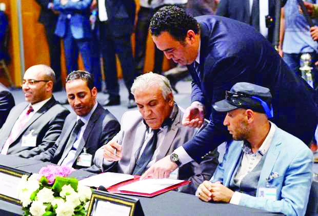Members of the Libyan Parliamentary delegation sign a new version of a UN-brokered peace deal during the talks in Skhirat, Morocco, in this file photo. (AFP)