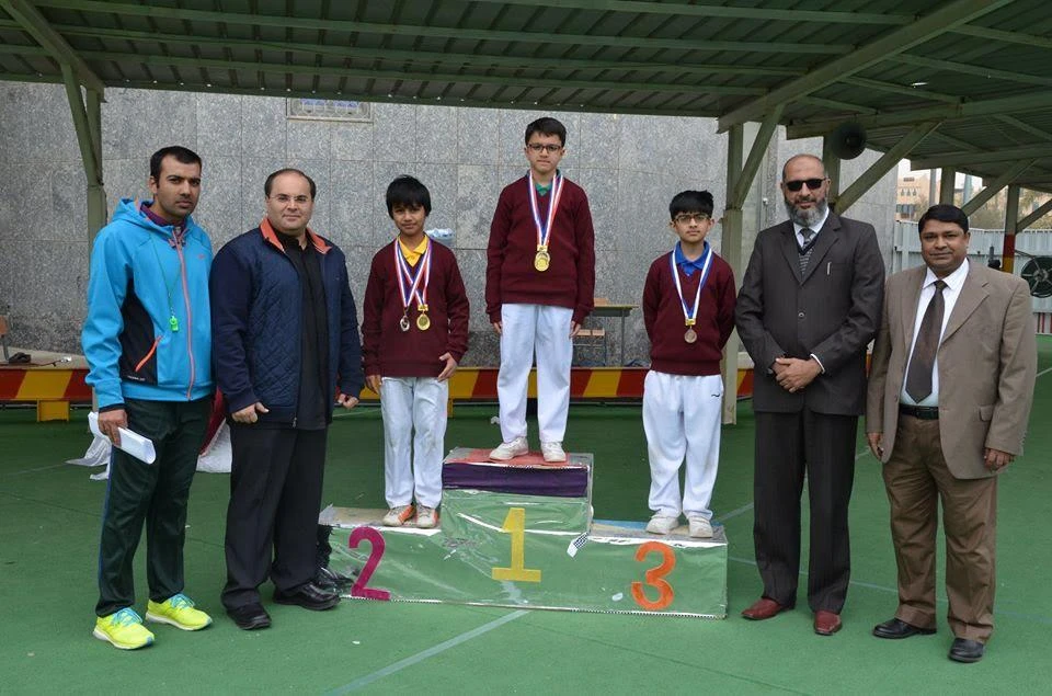 Principal Muhammad Tanveer with the winners of the Sports Week. (AN photo)