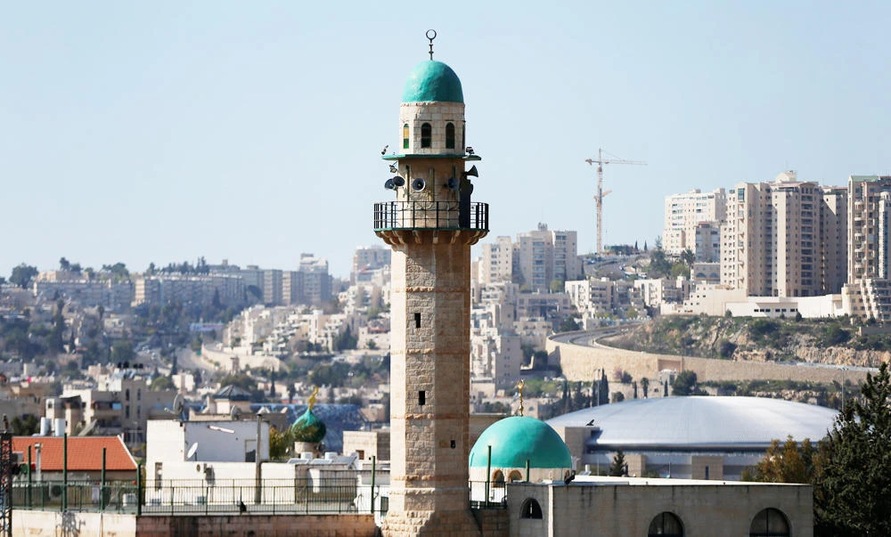 The minaret of a mosque is seen in the Palestinian neighbourhood of Beit Safafa in Jerusalem on Wednesday. (REUTERS)