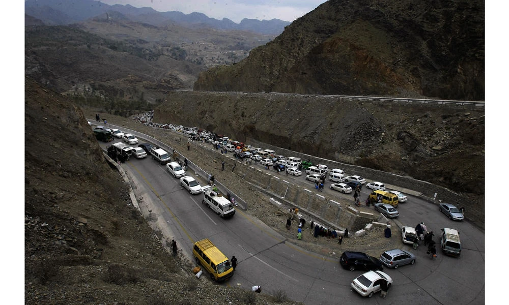 Vehicles carrying Afghan nationals travel through Pakistan's famous Khyber Pass en route to neighboring Afghanistan in Pakistan on March 7, 2017. (AP Photo/Muhammad Sajjad)
