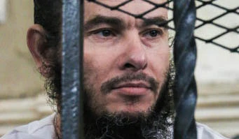 Adel Abu Al-Nur, a 50-year-old Egyptian defendant, sits behind bars in a courthouse on March 9, 2017 where sentenced to death during his trial where guilty of killing a Coptic Christian alcohol vendor on January 2, 2017 in the Mediterranean port city of Alexandria. (Image grab)