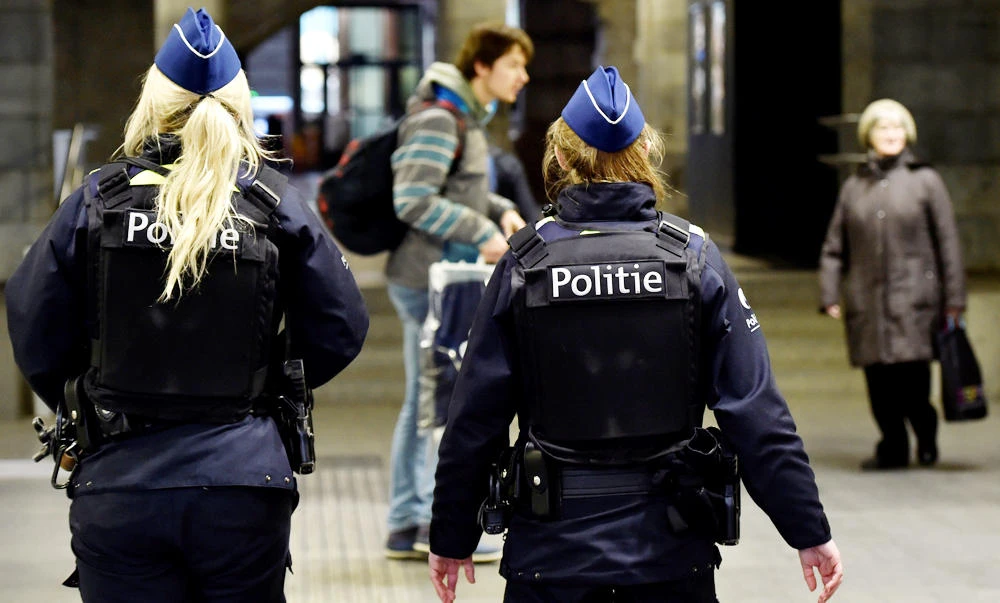 Belgian police officers patrol in the central station, in Antwerp, Belgium. (Reuters)