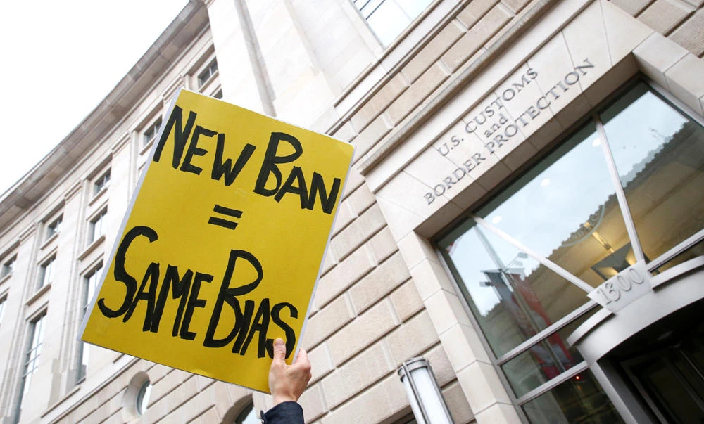 Immigration activists rally against the Trump administration's new ban against travelers from six Muslim-majority nations. (Reuters)