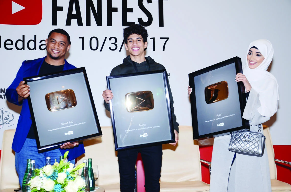From left to right, YouTubers Fahd Fal, Moha and Njoud receiving YouTube’s gold play button after their YouTube channels reached a million subscribers.