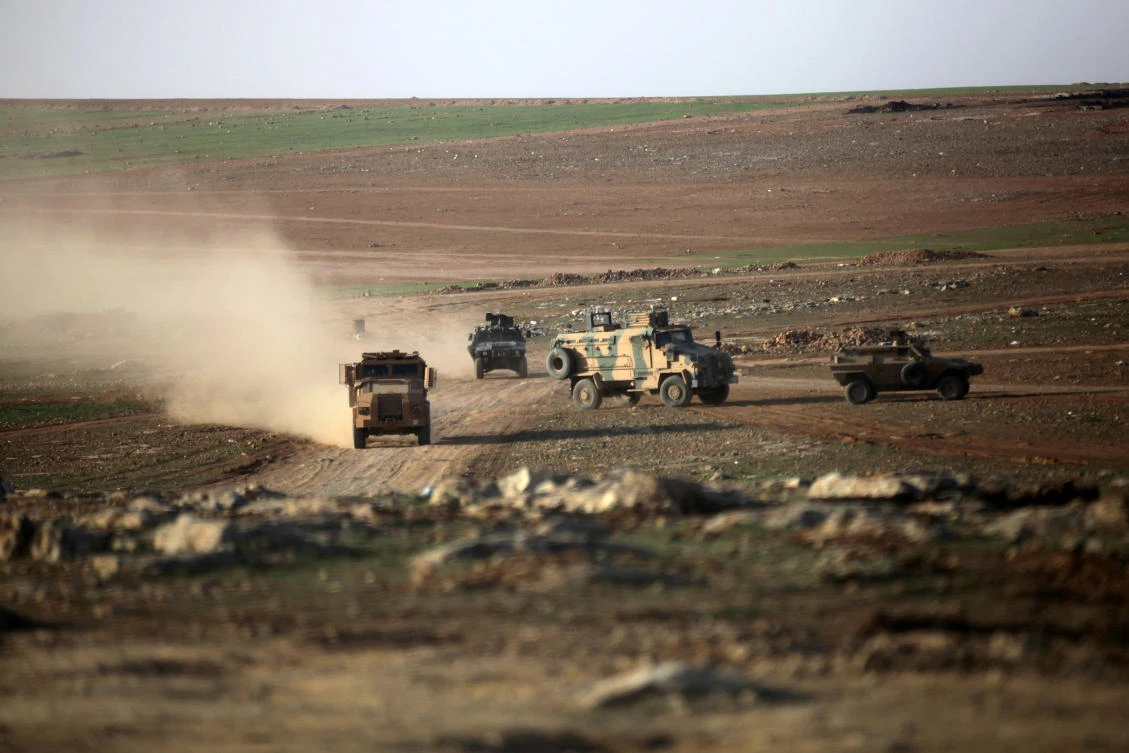 Turkish military vehicles drive east of Al-Bab town, Syria March. (REUTERS)
