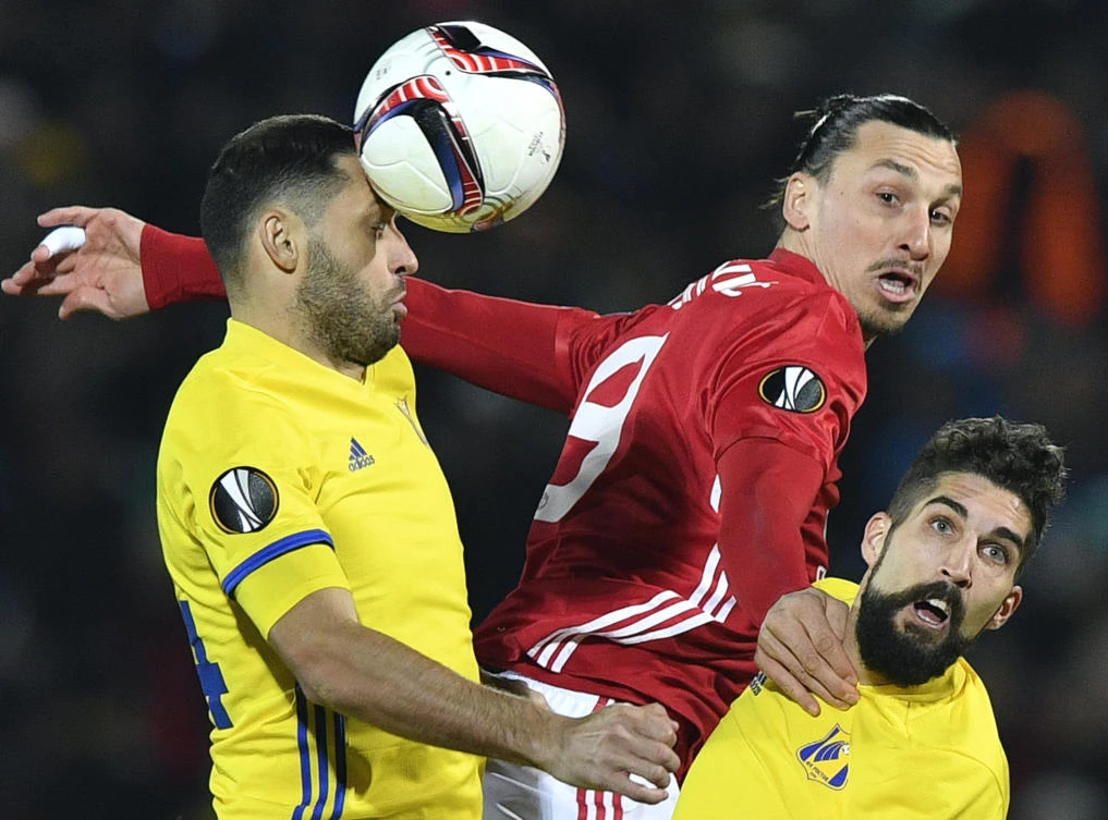 Manchester United striker Zlatan Ibrahimovic, center, fights for the ball with Rostov's Moldovan midfielder Aleksandr Gatskan, left, and Rostov's Slovenian defender Miha Mevlja, right, during the UEFA Europa League round of 16 football match at the Olimp-2 Arena in Rostov-on-Don on Thursday night. (AFP)
