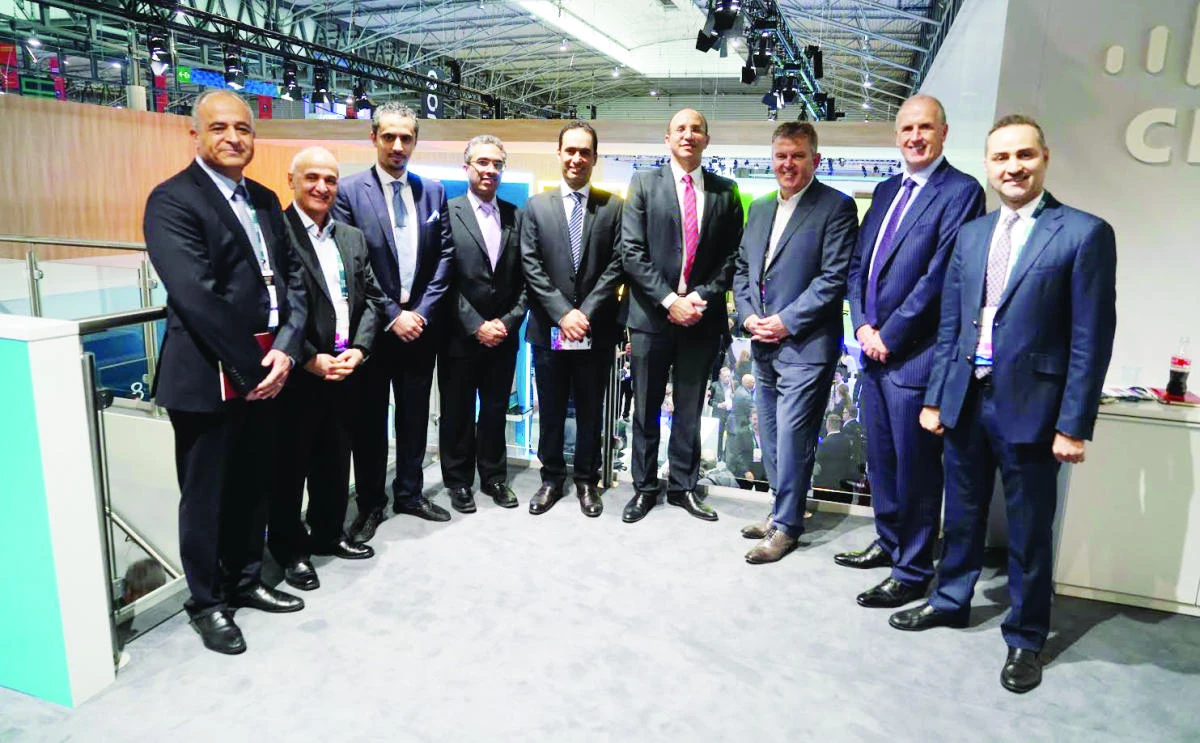 Maziad Alharbi, chief technology officer at Mobily, center, and Andy MacDonald, vice president, Global Service Provider, the Middle East, Africa and Russia, Cisco, second right, pose during the event.