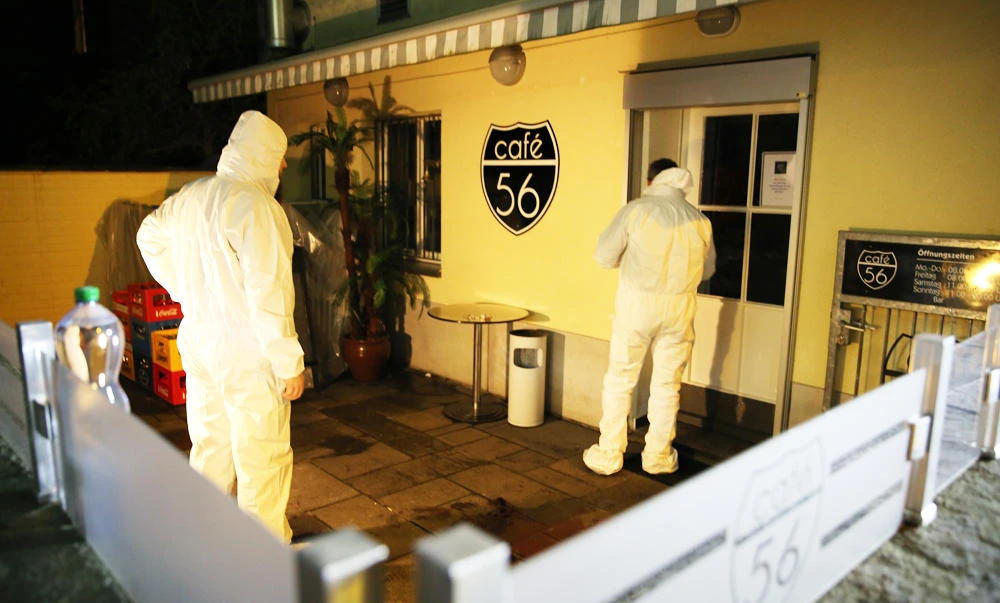 A forensic team investigates the scene after deadly gunfire was unleashed in Cafe 56, on Friday, in Basel, Switzerland. (AP)