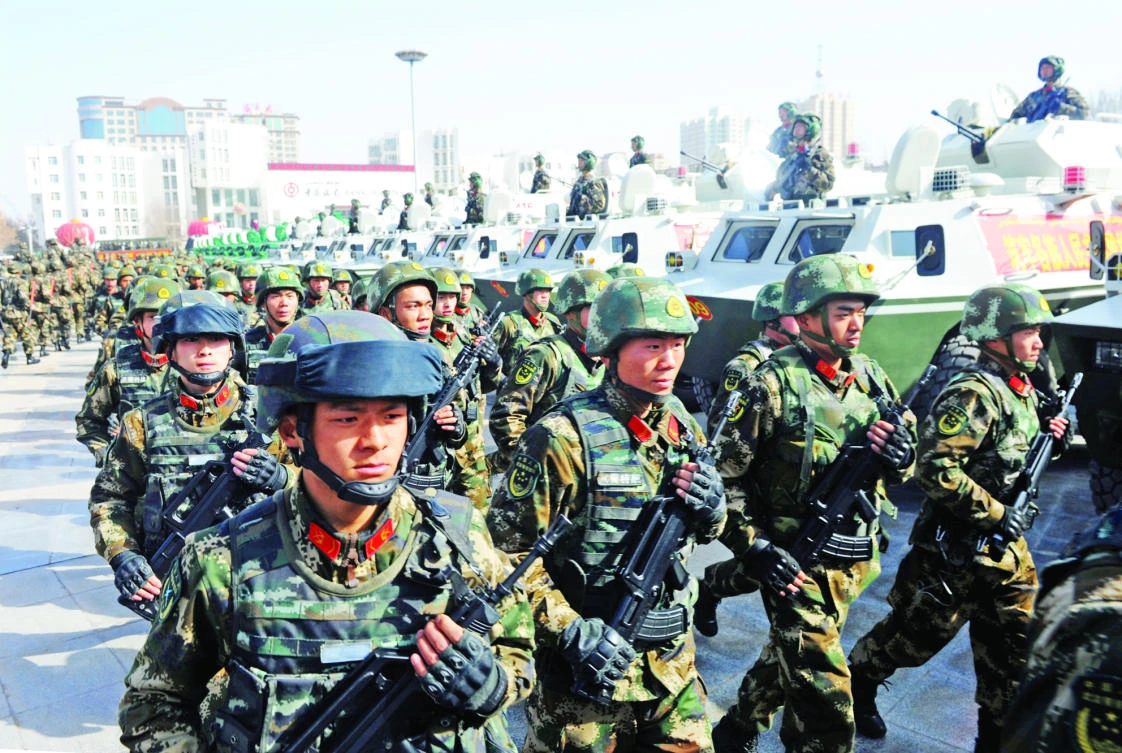 Paramilitary policemen stand in formation as they take part in an anti-terrorism oath-taking rally, in Kashgar, Xinjiang Uighur Autonomous Region,
China, in this file photo. (Reuters)